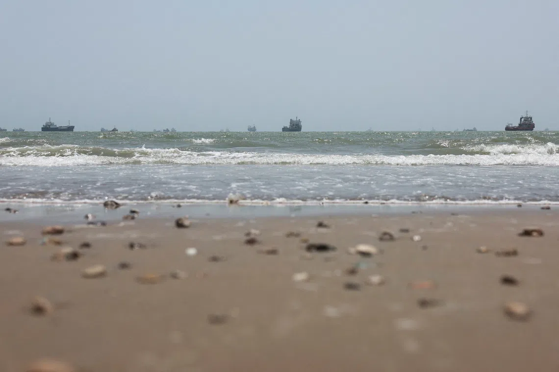 Vessels in the Strait of Hormuz are visible near the beach of Bandar Abbas, Iran, on Aug 25.