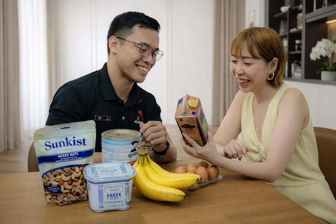 Barry Chew, training manager at Apex Training and Performance, discusses nutrition and lifestyle habits with a client. 