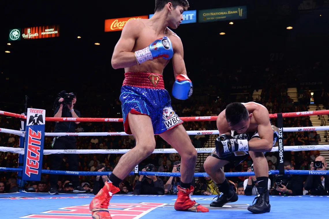 FILE PHOTO: Nov 2, 2019; Las Vegas, NV, USA; Ryan Garcia (blue trunks) knocks out Romero Duno (black trunks) during their WBC silver and NABO lightweight title bout at MGM Grand Garden Arena. Garcia won via first round TKO. Mandatory Credit: Joe Camporeale-USA TODAY Sports/File photo