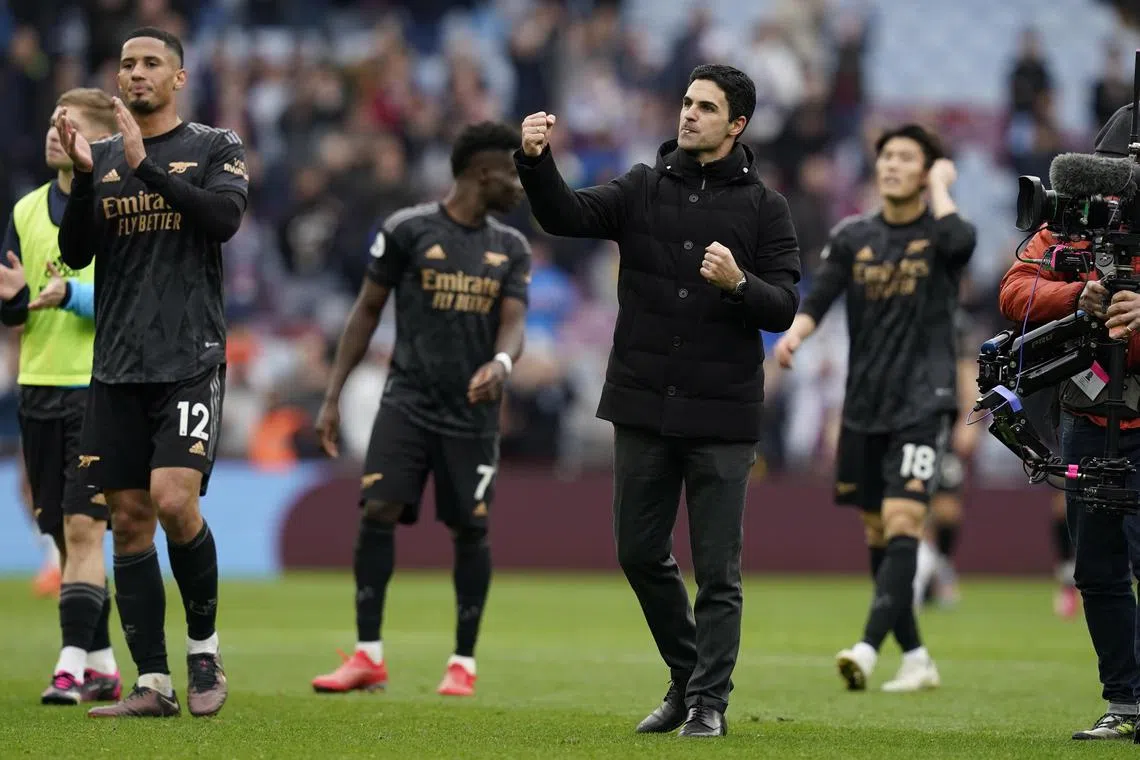 Two stoppage-time goals gave Arsenal a thrilling win at Villa Park.