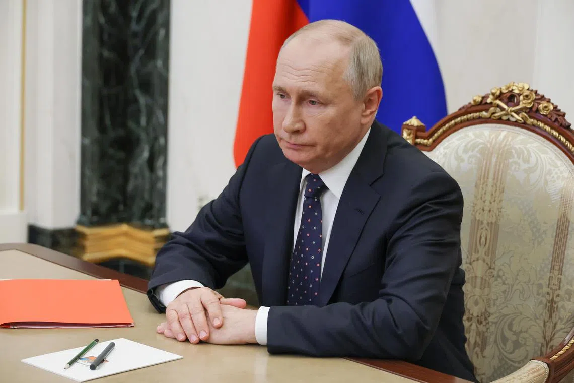 Russian President Vladimir Putin holding an operational meeting via video conference with permanent members of the Russian Security Council in Moscow on Friday. 