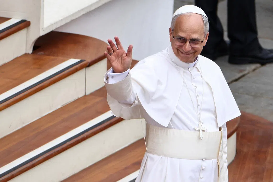 Pope Leo XIV waves on the day of his first general audience in St. Peter's Square at the Vatican, May 21, 2025. REUTERS/Yara Nardi