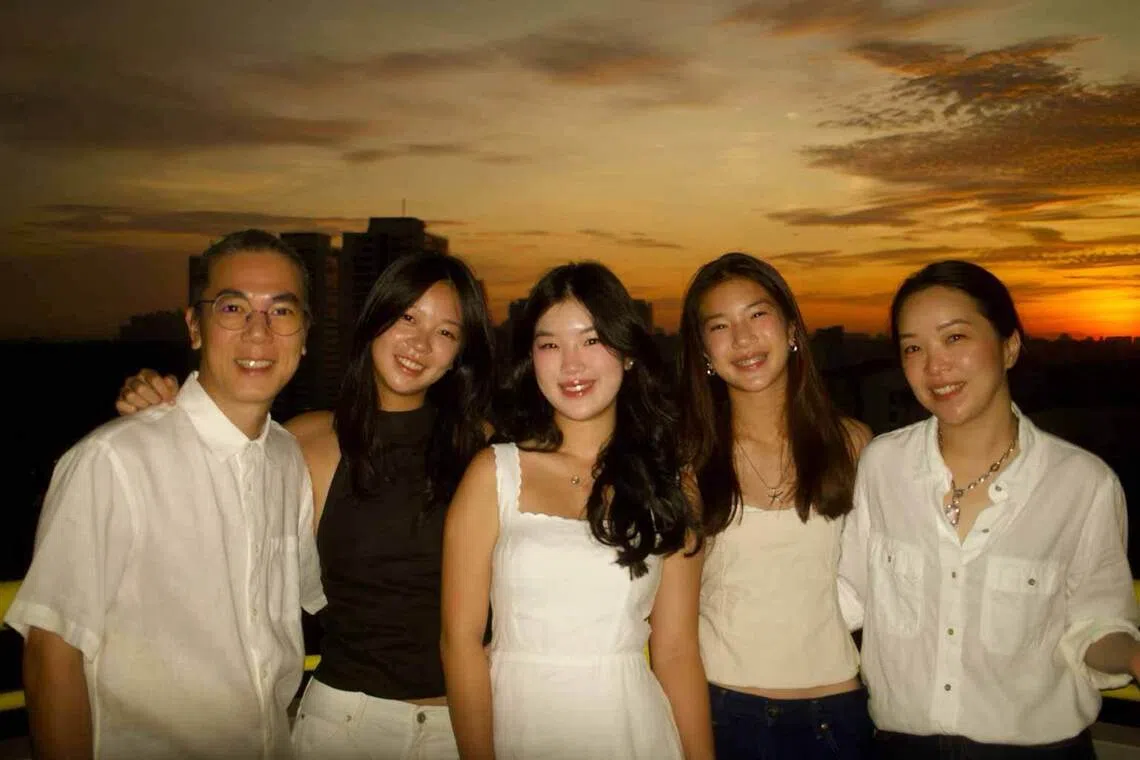 the foong family from singapore, who share a love of football, pictured from left: father zacc foong, sisters tia foong, tasha foong and tyan foong, and mother deon loon
