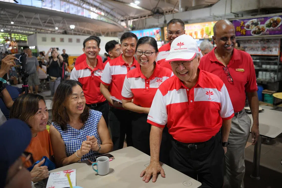 Progress Singapore Party chairman Tan Cheng Bock (front, right) with other PSP leaders and Singapore Democratic Party chairman Paul Tambyah during a walkabout at Teban Gardens Food Centre on April 26.