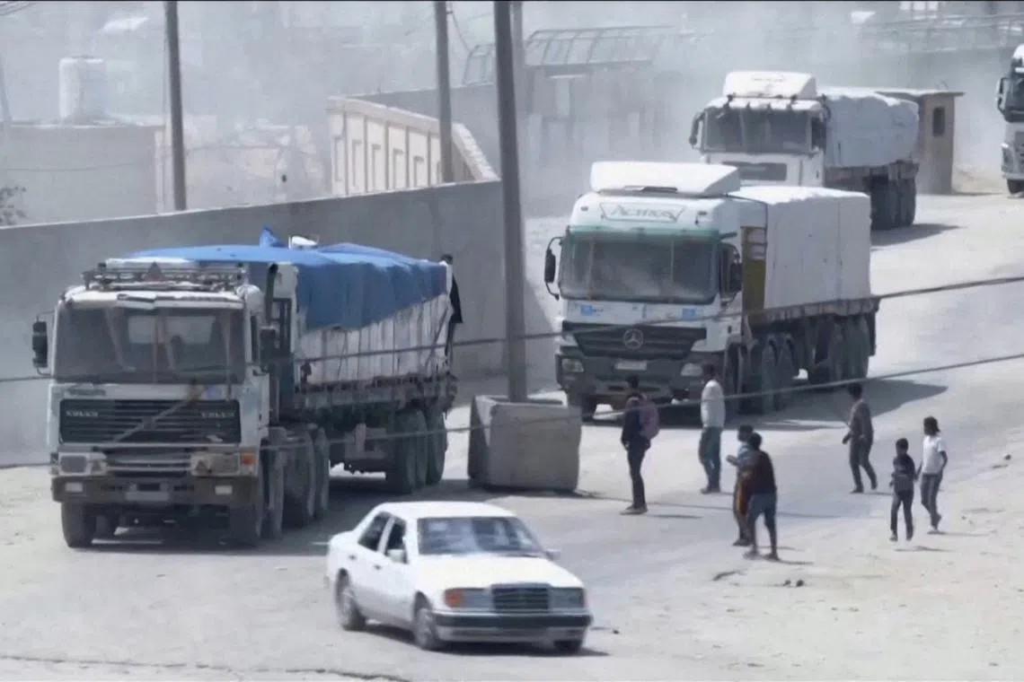 FILE PHOTO: A convoy of aid trucks drives into Gaza from Rafah crossing, April 9, 2024, amid the ongoing conflict between Israel and the Palestinian Islamist group Hamas, in this screen grab taken from video. REUTERS TV/via REUTERS/File Photo