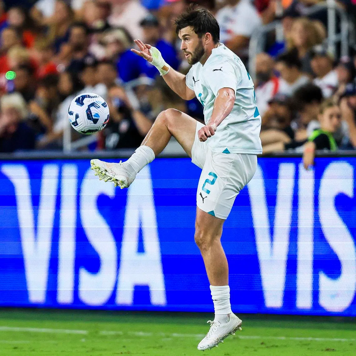 Sep 10, 2024; Cincinnati, Ohio, USA; New Zealand defender Tim Payne (2) kicks the ball against the USA in the second half at TQL Stadium. Mandatory Credit: Katie Stratman-Imagn Images