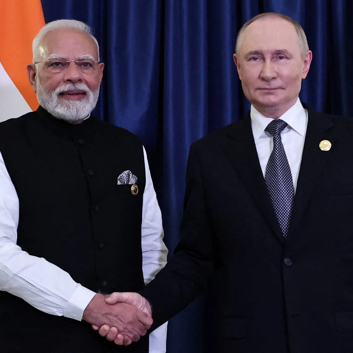 Russian President Vladimir Putin and Indian Prime Minister Narendra Modi shake hands during a meeting on the sidelines of the Shanghai Cooperation Organisation (SCO) summit in Tianjin, China, September 1, 2025. Sputnik/Alexander Kazakov/Pool via REUTERS