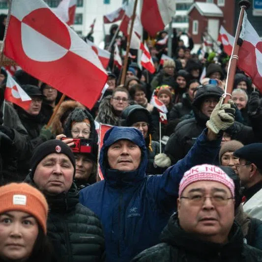 Crowds in Nuk waving the flag of Greenland in protest against President Donald Trump's takeover ambitions, the pursuit of which is threatening to unravel NATO.  