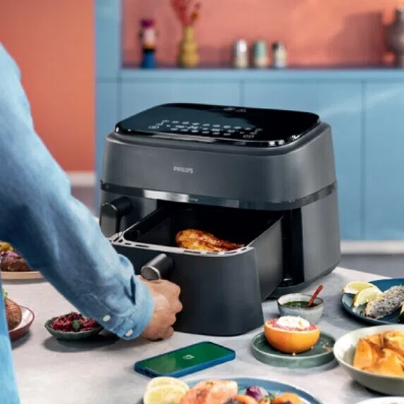 Man cooking using an airfryer