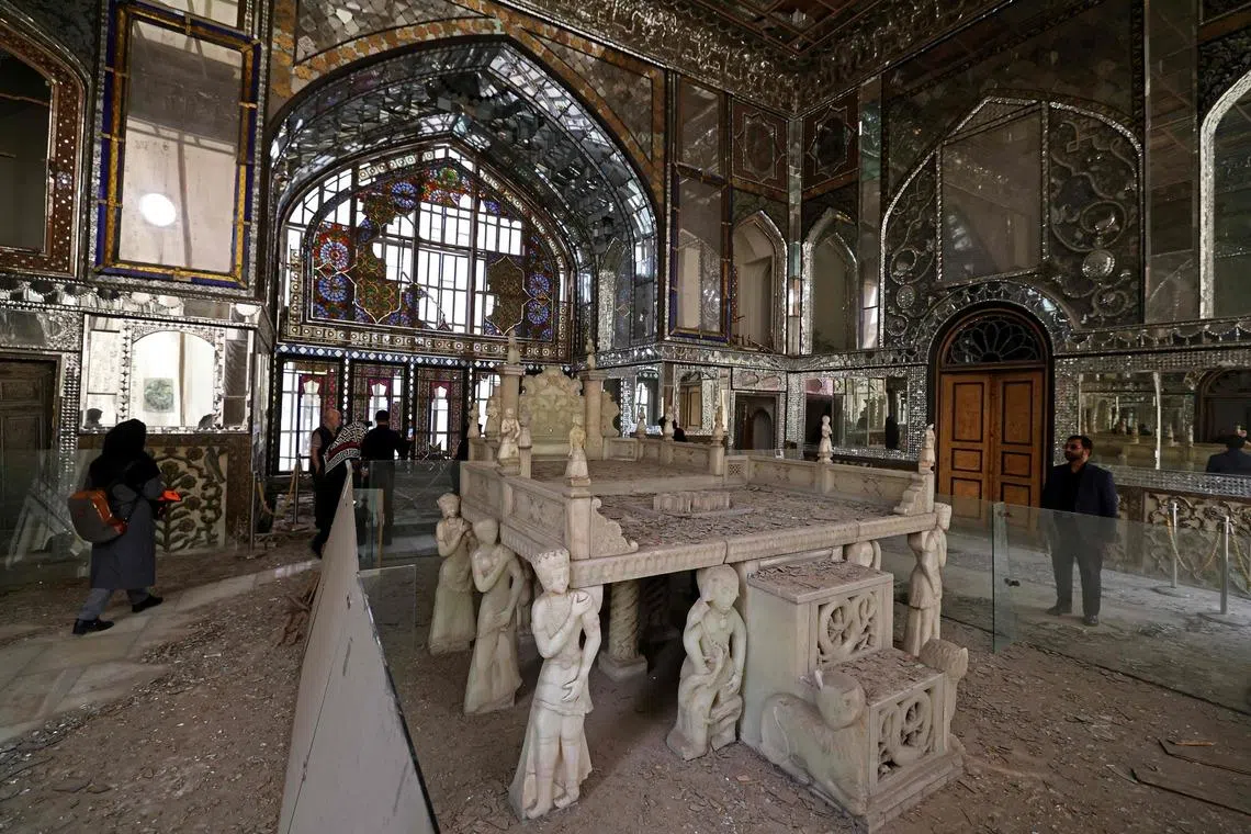 Visitors walking through the damaged interiors of the historic Golestan Palace in Tehran, on April 4.