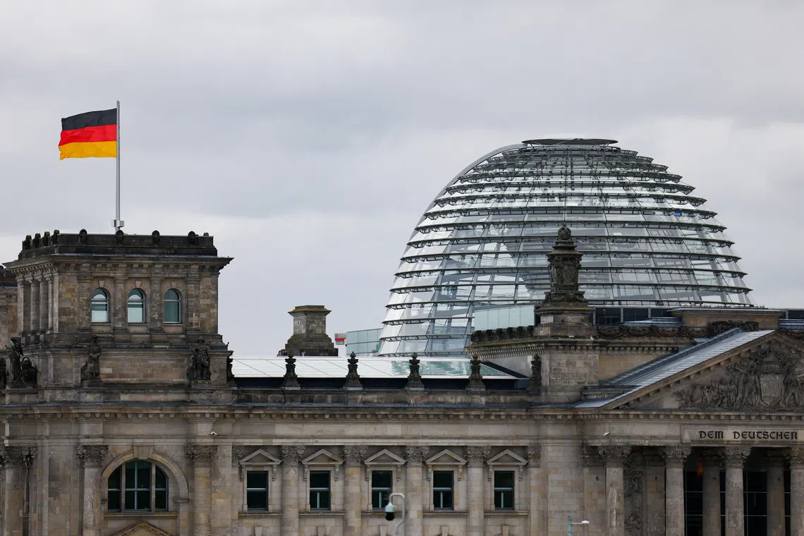The German flag flutters outside the Reichstag building, the seat of the German parliament, the Bundestag, in Berlin, Germany, September 16, 2025. REUTERS/Lisi Niesner