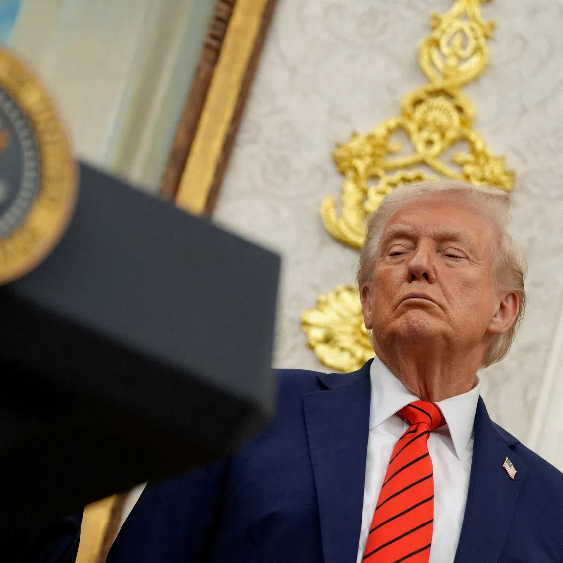 FILE PHOTO: U.S. President Donald Trump listens during an announcement about lowering U.S. drug prices, at the White House in Washington, D.C., U.S., October 10, 2025. REUTERS/Kent Nishimura/File Photo