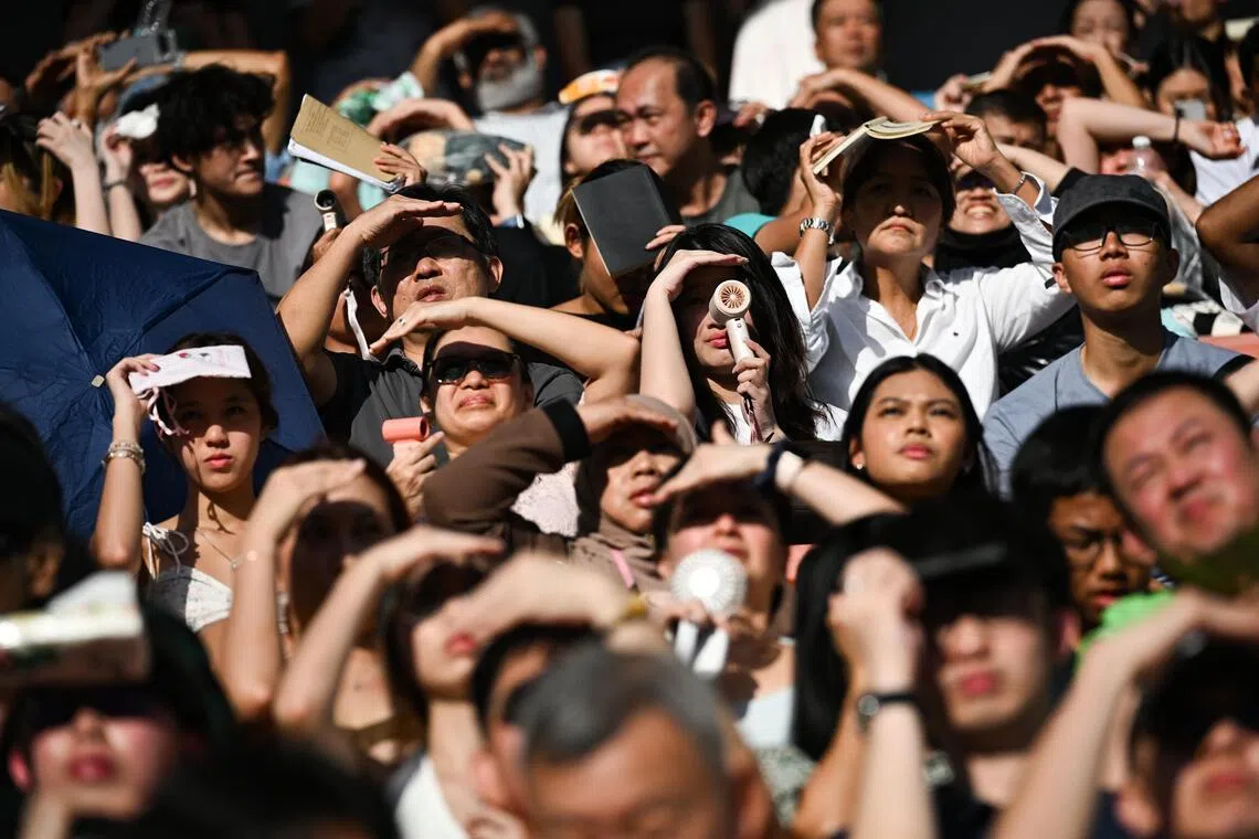 More Singapore travellers are turning to portable cooling devices such as handheld fans, which have grown more popular.