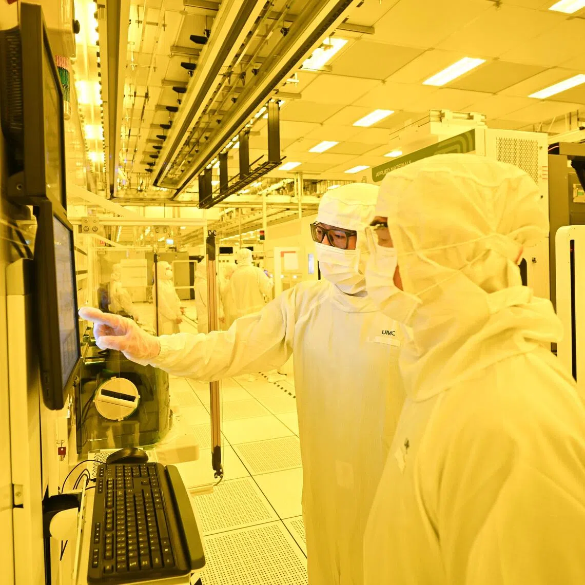 ST20250401-202567400139-Lim Yaohui-Sheila Chiang-scumc01/
Staff from UMC checking equipment parameters inside the cleanroom during the grand opening of UMC’s new advanced fab expansion in Singapore on April 1, 2025.
This milestone represents a major leap in semiconductor manufacturing, strengthening Singapore’s position as a global tech and innovation hub while creating high-value local job opportunities.
With this launch, UMC’s Singapore site will become one of the most advanced semiconductor fabs in the country, further cementing its role in driving cutting-edge advancements and reinforcing Singapore’s leadership in the global supply chain.
(ST PHOTO: LIM YAOHUI)