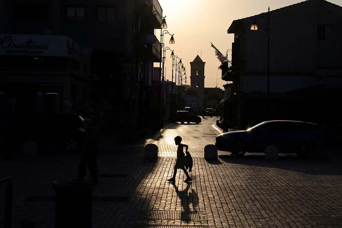 A boy walks near St. Lazarus Church in Larnaca, Cyprus August 29, 2024. REUTERS/Yiannis Kourtoglou TPX IMAGES OF THE DAY