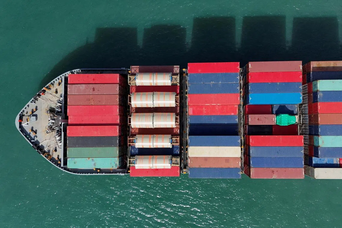 FILE PHOTO: A drone view shows a cargo ship at Kwai Tsing Container Terminals in Hong Kong, China, April 16, 2025. REUTERS/Tyrone Siu/File Photo