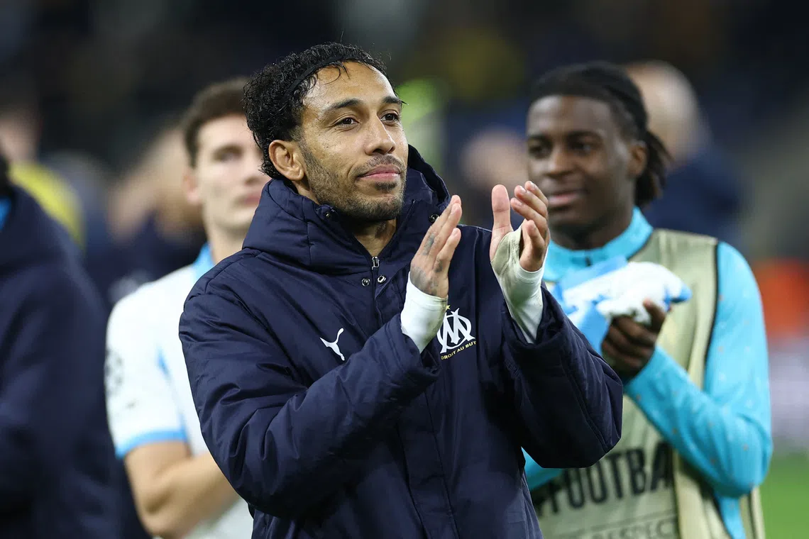 Soccer Football - UEFA Champions League - Union Saint-Gilloise v Olympique de Marseille - Stade Joseph Marien, Brussels, Belgium - December 9, 2025 Olympique de Marseille's Pierre-Emerick Aubameyang applauds fans after the match REUTERS/Yves Herman