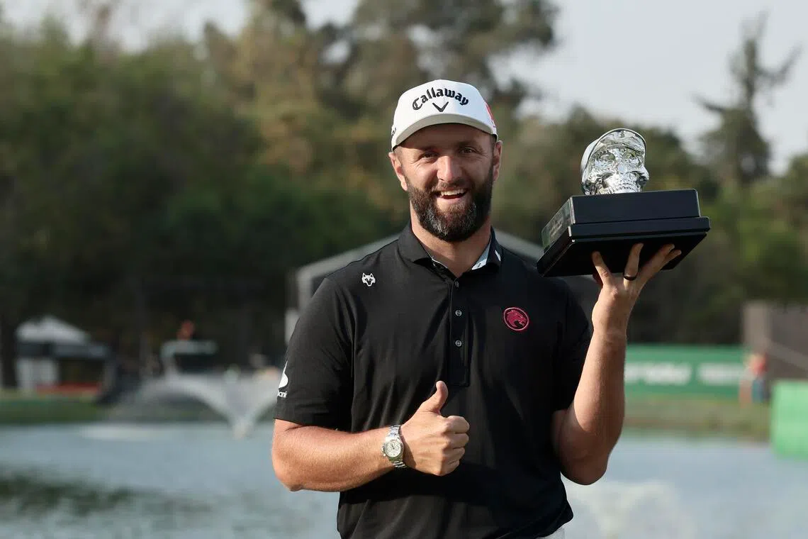 Jon Rahm of Team Legion XIII holds the winner’s trophy after his victory in the fourth round of the LIV Golf tournament in Mexico City.