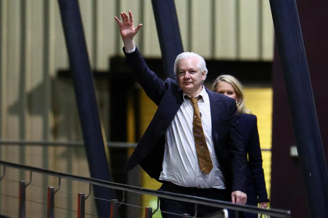 WikiLeaks founder Julian Assange waves as he arrives in Canberra, Australia, June 26, 2024. REUTERS/Edgar Su/ File Photo
