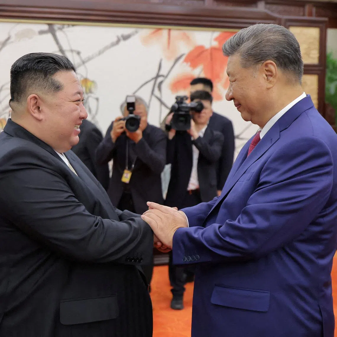 North Korean leader Kim Jong Un and Chinese President Xi Jinping shake hands on the day of their bilateral summit in Beijing on Sept 4, 2025.