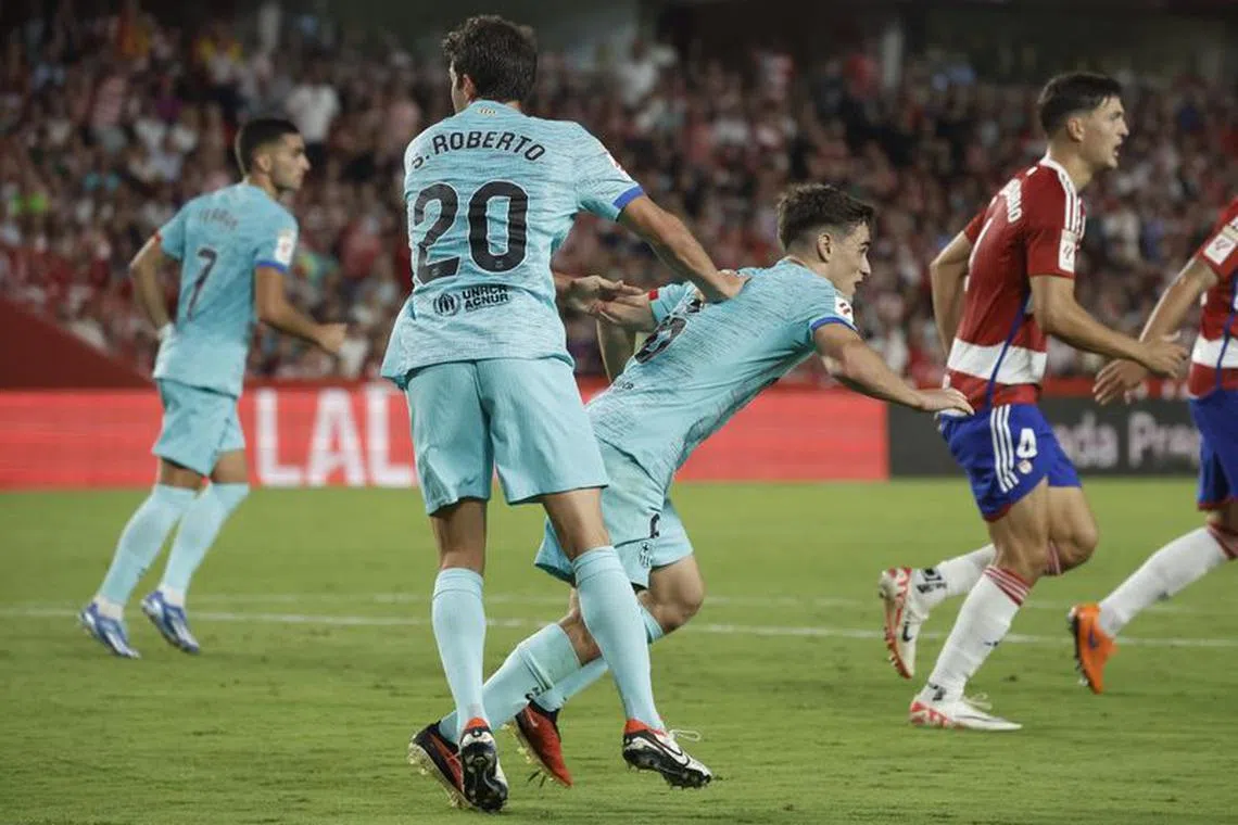 Soccer Football - LaLiga - Granada v FC Barcelona - Nuevo Estadio de Los Carmenes, Granada, Spain - October 8, 2023 FC Barcelona&#039;s Sergi Roberto celebrates scoring their second goal with Gavi REUTERS/Jon Nazca