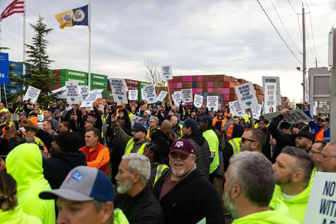 Workers picket outside of the APM container terminal at the Port of Newark in Newark, New Jersey, US, on Tuesday, Oct. 1, 2024. Dockworkers walked out of every major port on the US East and Gulf coasts for the first time in nearly 50 years, staging a strike that could ripple across the world’s largest economy and cause political turmoil just weeks before the presidential election. Photographer: Michael Nagle/Bloomberg