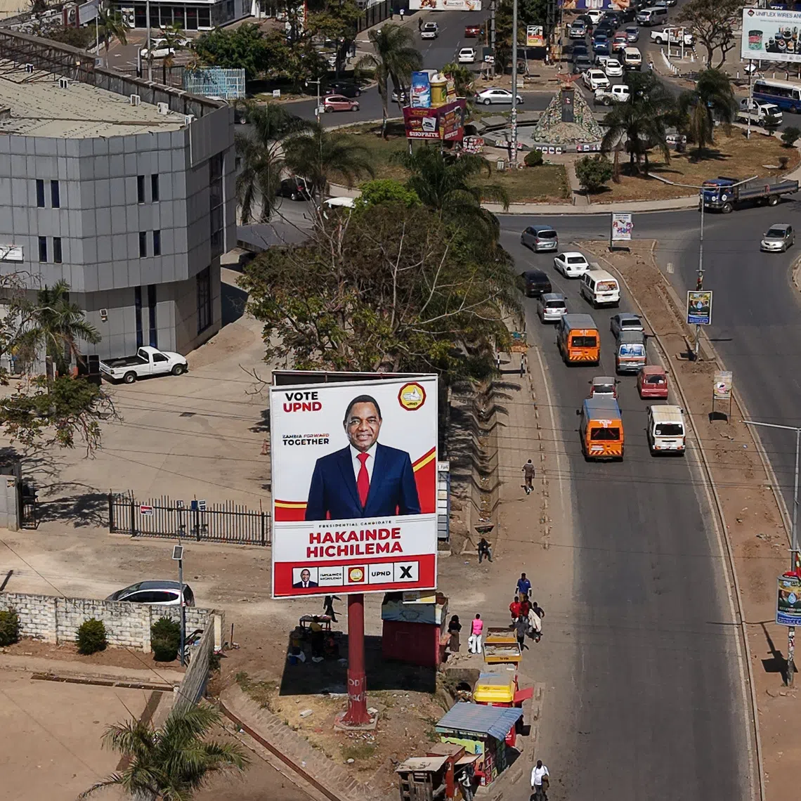 A drone view shows a campaign billboard for Zambian President Hakainde Hichilema, ahead of the country's general election on August 13, along a road in central Lusaka, Zambia, August 8, 2026. REUTERS/Moses Mwape