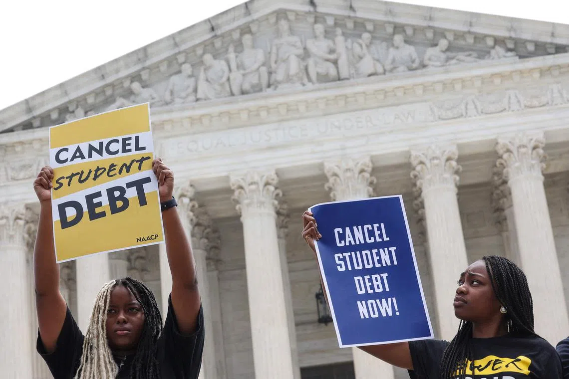 Demonstrators in favour of student loan debt forgiveness rally outside the US Supreme Court in Washington.
