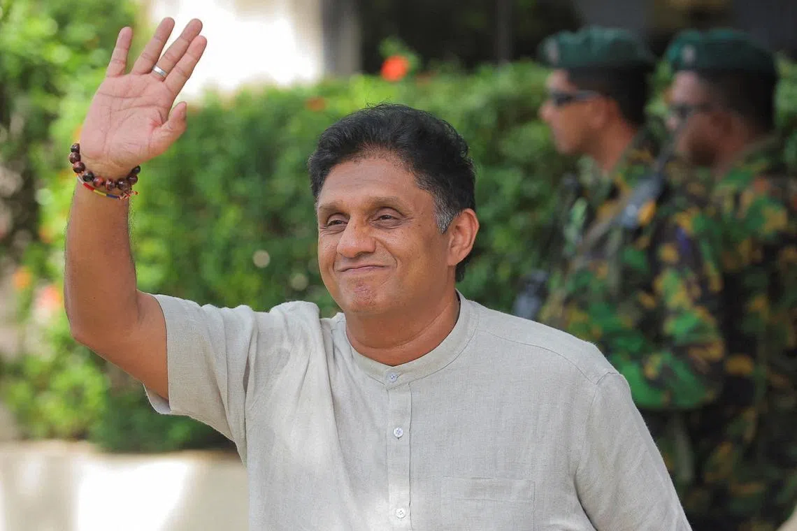 Sajith Premadasa, leader of the Samagi Jana Balawegaya, party gestures as he arrives at the Election Commission in Rajagiriya to submit his nomination papers for the upcoming presidential election, scheduled for September 21, in Colombo, Sri Lanka August 15, 2024. REUTERS/Dinuka Liyanawatte