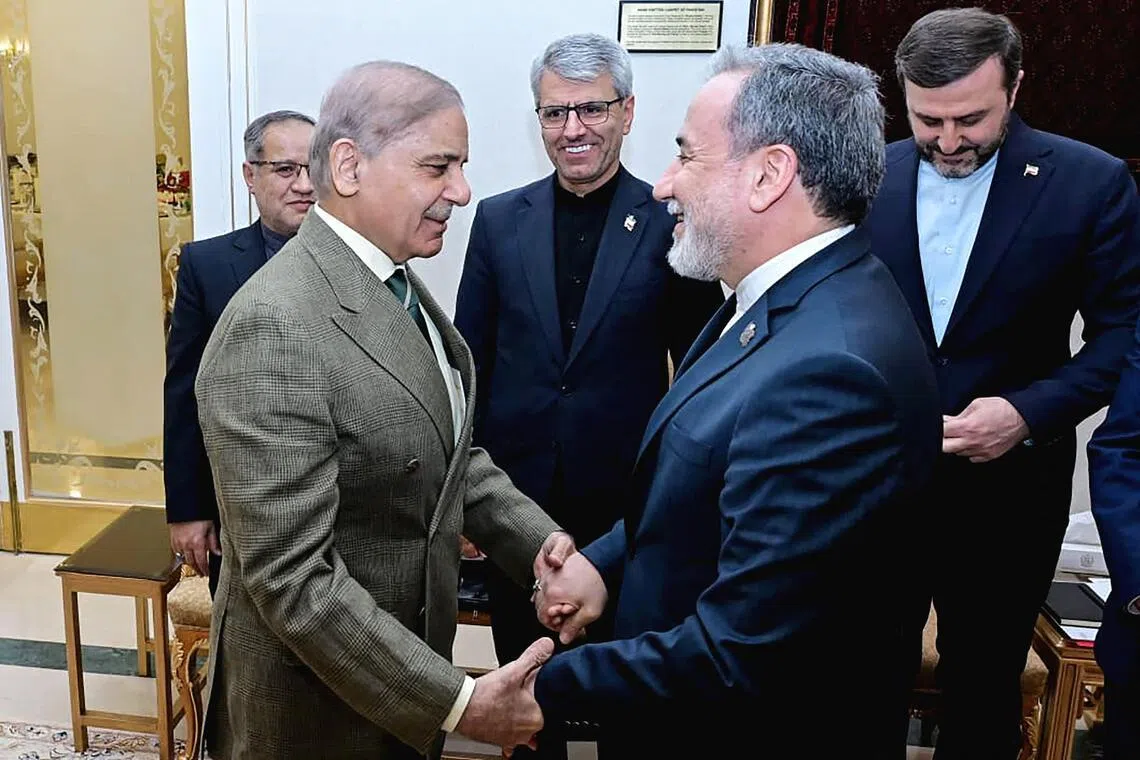 Pakistani Prime Minister Shehbaz Sharif (left) greeting Iranian Foreign Minister Abbas Araqchi before their meeting in Islamabad on April 25. Mr Araqchi flew out of the Pakistani capital following their talks.