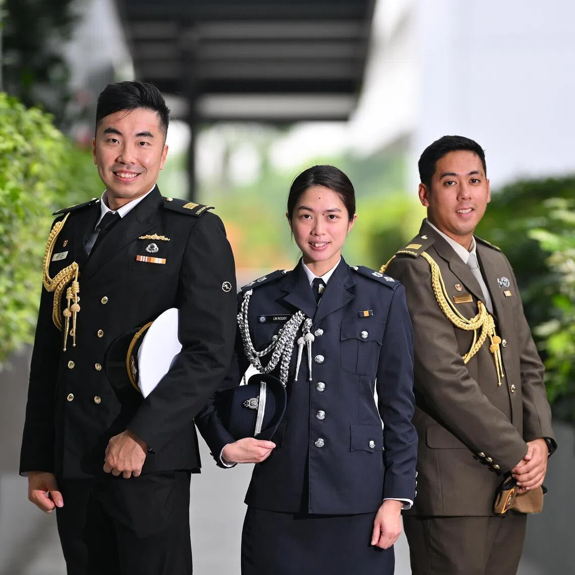 (From left) 3rd Flotilla Support Group from RSN Captain Gilbert Toh Wei Han, Deputy Superintendent of Prisons Lin Rouxiu from the Singapore Prison Service; and Officer Commanding of 1st Battalion Singapore Guards from Army Captain Ahmad Hafizuddin Abdul Hamid attending the Aides-de-Camp Appointment Ceremony and Appreciation Reception at MINDEF Annex Building on May 25.