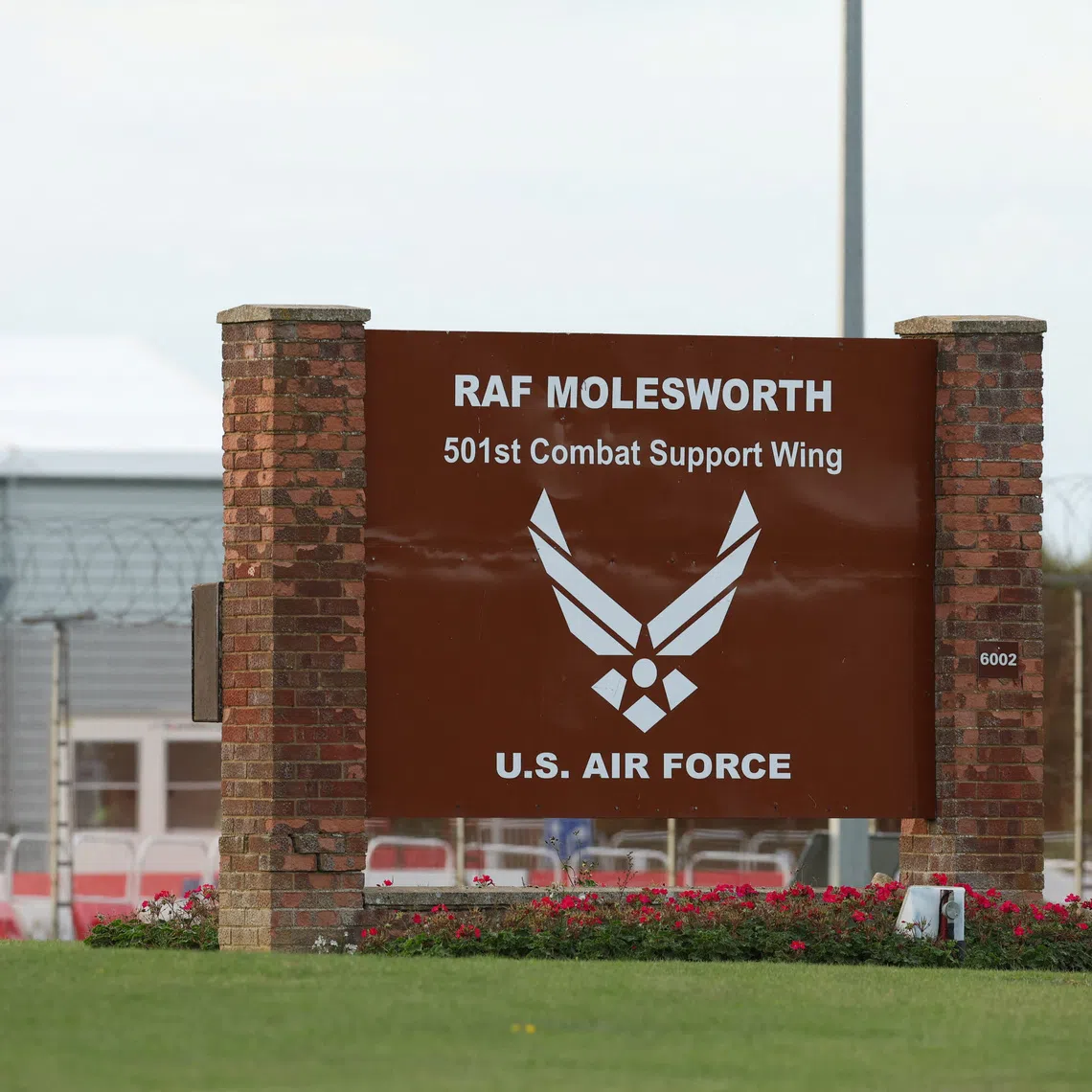 A sign at the entrance of RAF Molesworth, after two Latvian nationals were arrested on suspicion of entering a prohibited place for a purpose prejudicial to the UK, police said in a statement, in Cambridgeshire, Britain, October 8, 2026. REUTERS/Chris Radburn