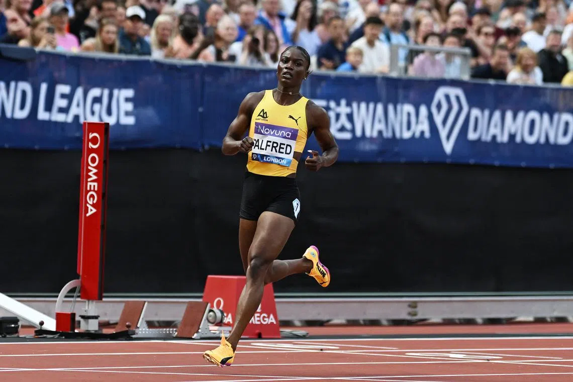 FILE PHOTO: Athletics - Diamond League - London - London Stadium, London, Britain - July 19, 2025 St Lucia's Julien Alfred celebrates after winning the Women's 200m final REUTERS/Dylan Martinez/File Photo