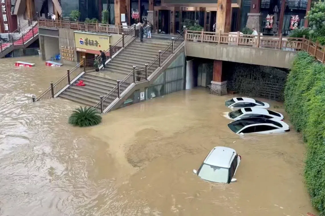 Cars lie partially submerged in floodwaters after heavy rainfall in Duyun, Guizhou Province, China, May 19, 2026, in this still image obtained from a social media video. Social Media/via REUTERS  THIS IMAGE HAS BEEN SUPPLIED BY A THIRD PARTY. NO RESALES. NO ARCHIVES.  VERIFICATION:  - Business signages, buildings, the river, the bridge and road layout matched file and satellite imagery. - Date confirmed by local authorities and no earlier version was found posted online before May 19. - The local government forecasted that urban waterways would experience flood peak passage at 6 a.m. (GMT+8) and raised the flood control emergency response to Level II on May 19.