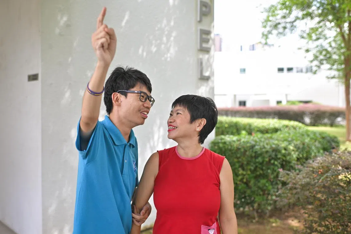 ST20240624_202434213736/sfautism/Shintaro Tay/Chin Soo Fang/ Ms Sharon Lee (in red), 52, an executive coach, with her son Lucas Tan, 27, who has autism, at the St Andrew's Day Activity Centre at Siglap on June 24, 2024.