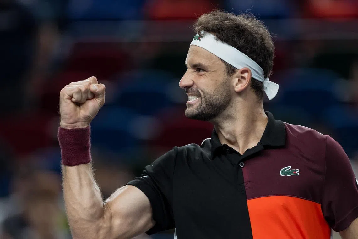 Grigor Dimitrov of Bulgaria celebrating after winning the match against Carlos Alcaraz of Spain at the Shanghai Masters tennis tournament on Tuesday.