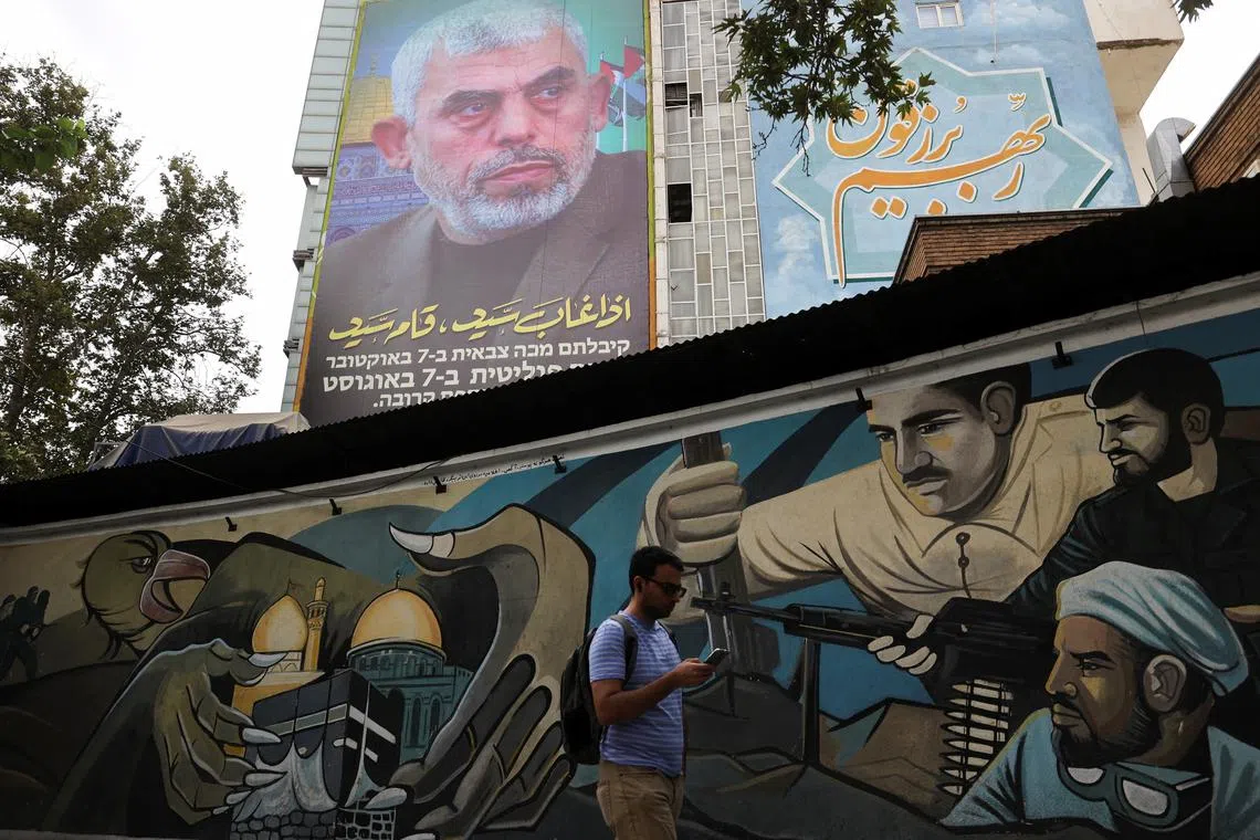 FILE PHOTO: A billboard with a picture of newly appointed Hamas leader Yahya Sinwar is displayed on a building in a street in Tehran, Iran, August 12, 2024. Majid Asgaripour/WANA (West Asia News Agency) via REUTERS/File Photo