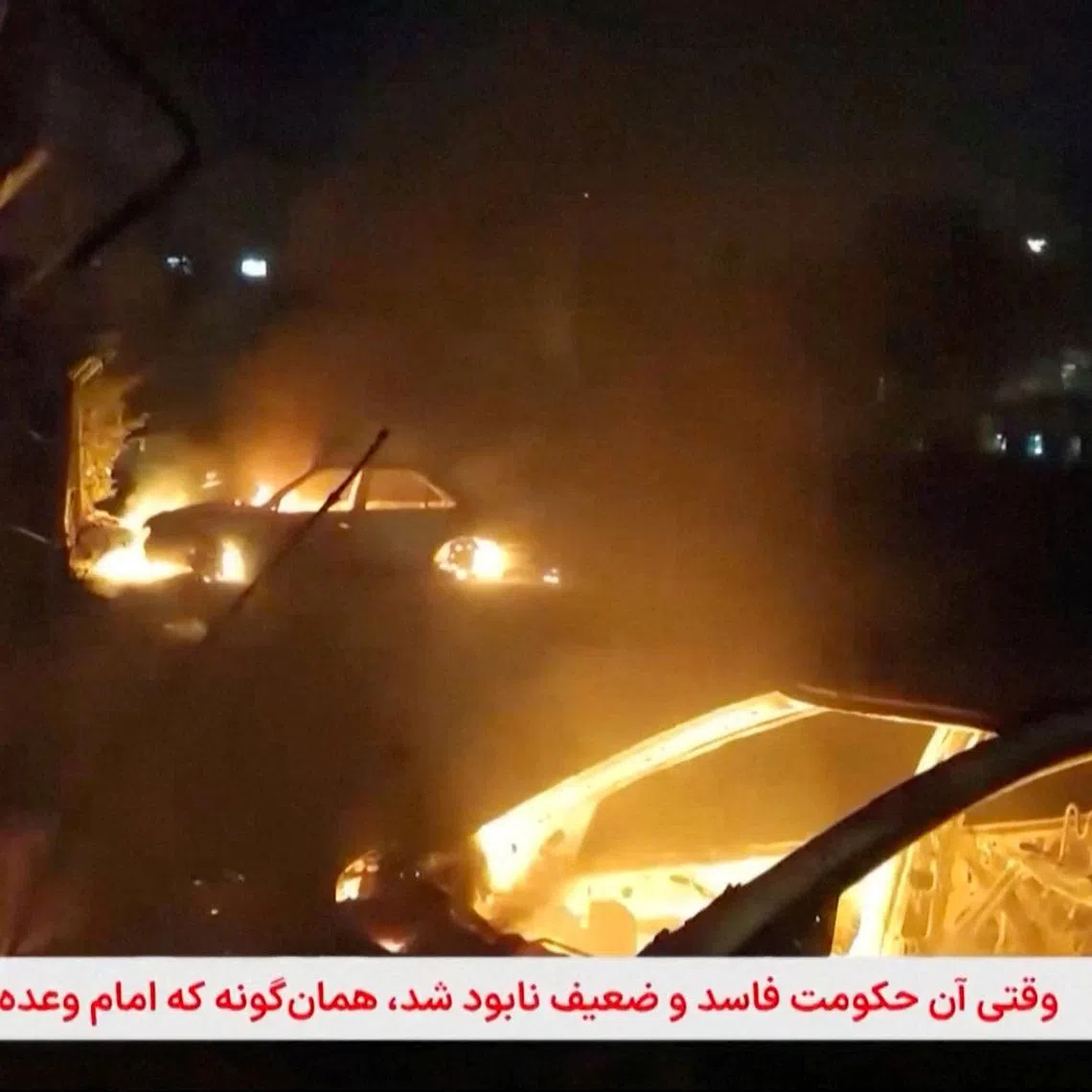 Flames engulf cars following unrest sparked by dire economic conditions, in a place given as Isfahan, Iran, January 9, 2026, in this screengrab from Iran's state media broadcast footage. IRIB via WANA(West Asia News Agency) via REUTERS
