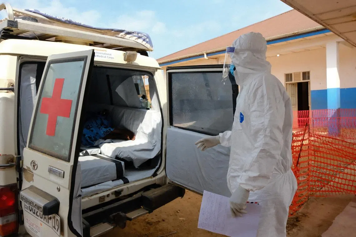 An ambulance transports a patient accompanied by a doctor wearing personal protective equipment (PPE) to the Ebola Virus Disease Treatment Center, one month after cases were confirmed in Bunia, eastern Democratic Republic of Congo, June 15, 2026. REUTERS/Gradel Muyisa Mumbere