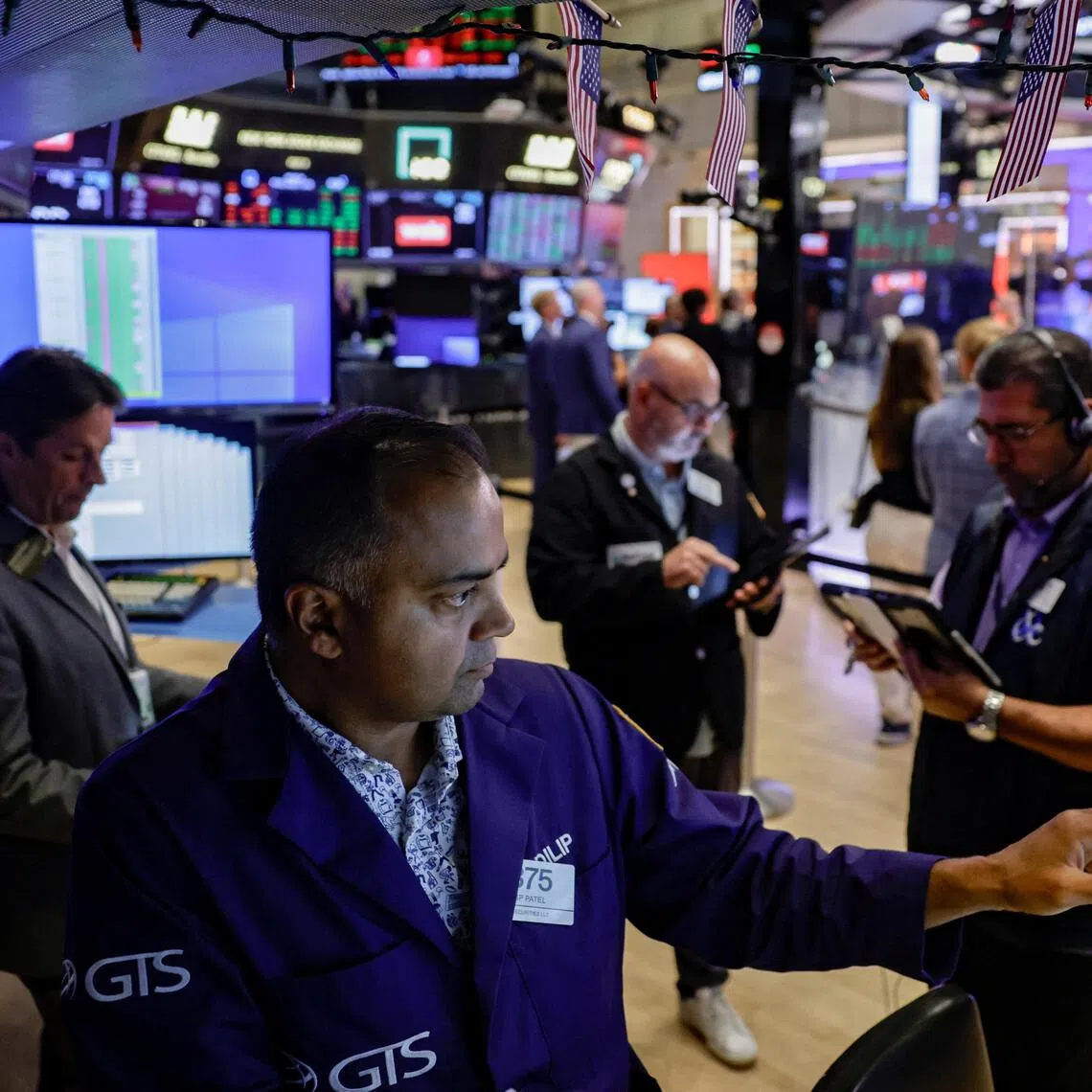 Traders working on the floor of the New York Stock Exchange, in New York City, on Aug 7.