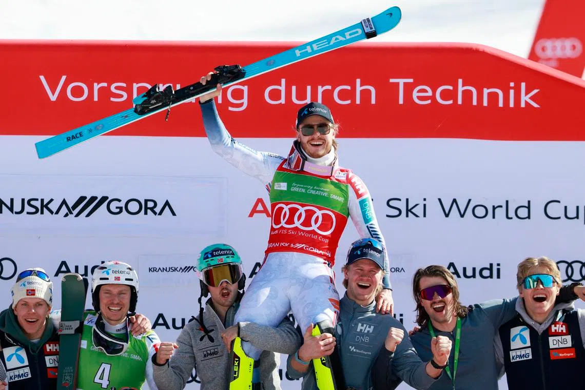 Alpine Skiing - FIS Alpine Ski World Cup - Men's Slalom - Kranjska Gora, Slovenia - March 8, 2026 Norway's Atle Lie McGrath celebrates with his team on the podium after winning the Men's Slalom REUTERS/Borut Zivulovic