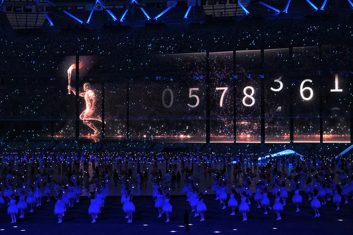 A digital torch bearer is seen during the lighting of the cauldron during the opening ceremony of the 19th Asian Games held at the Hangzhou Olympic Sports Center Stadium in Hangzhou, China, on Sept 23, 2023.