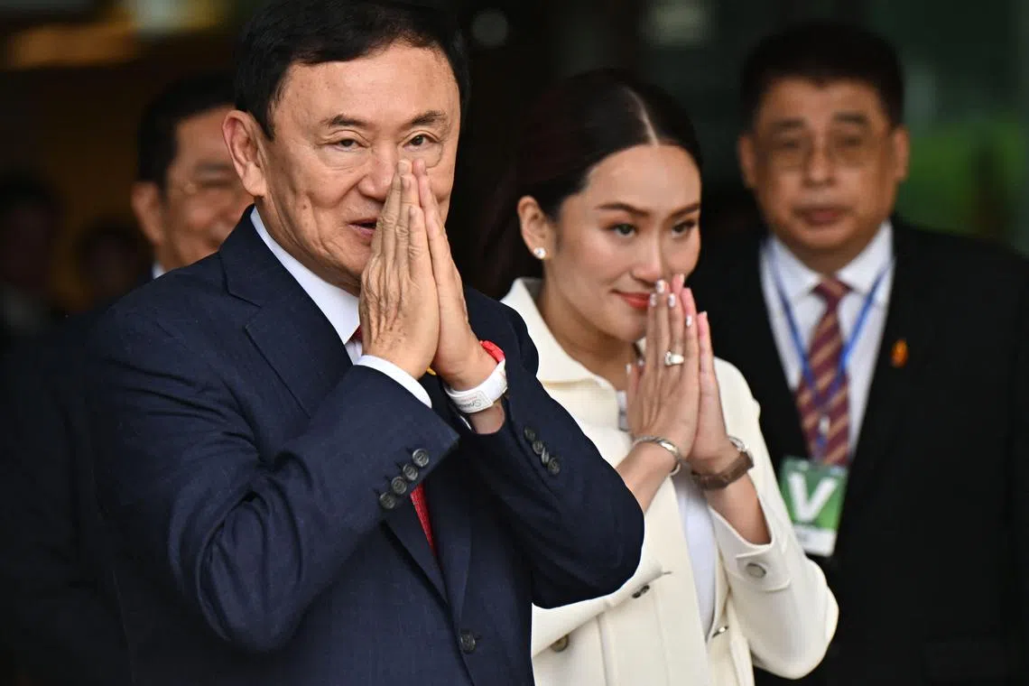 Former Thai prime minister Thaksin Shinawatra is widely seen as wielding significant influence in setting the direction for the government headed by his daughter Paetongtarn Shinawatra (right).