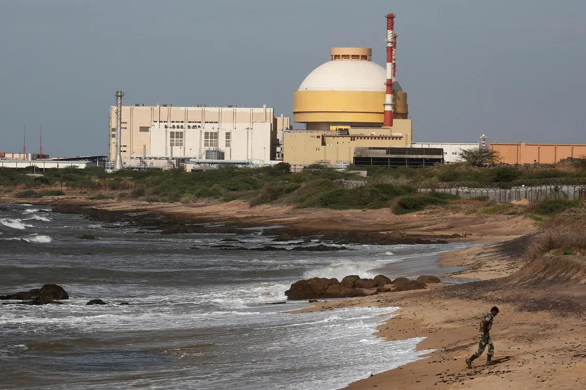 FILE PHOTO: A policeman walks on a beach near the Kudankulam nuclear power project in the southern Indian state of Tamil Nadu on September 13, 2012.  REUTERS/Adnan Abidi/File Photo