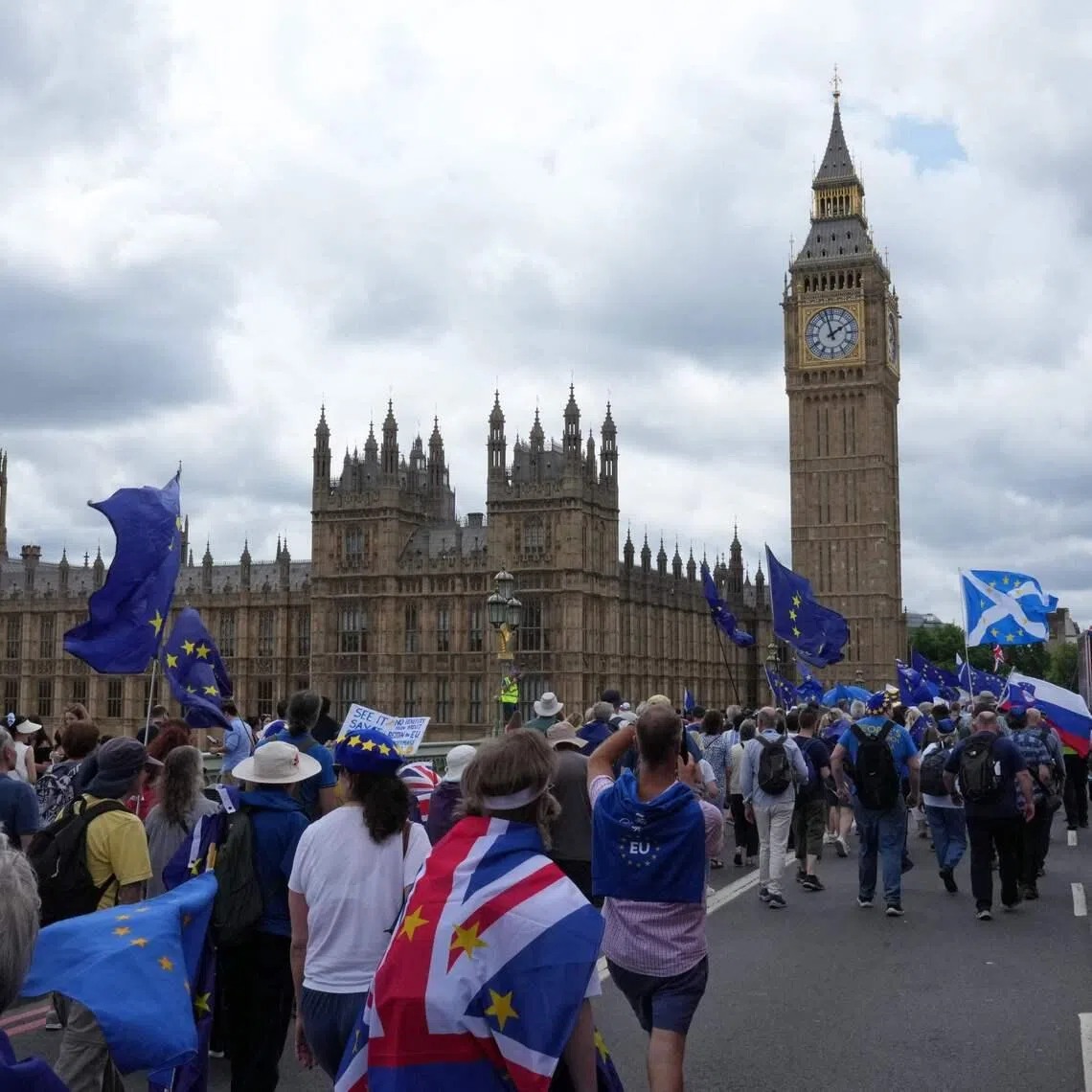 People marching over Westminster Bridge in London on June 20 to campaign for Britain to rejoin the European Union.