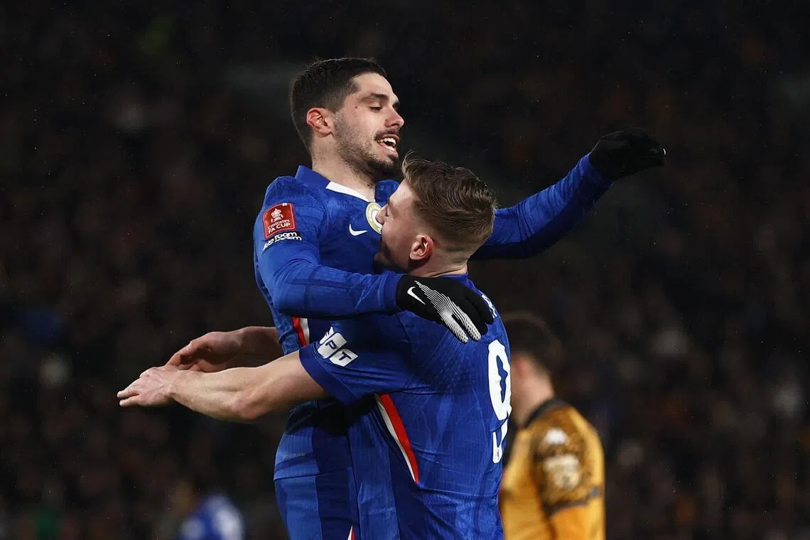 Chelsea's Pedro Neto (left) and Liam Delap celebrating their third goal, scored by Estevao Willian, in their 4-0 win over Hull City in the FA Cup on Feb 13.