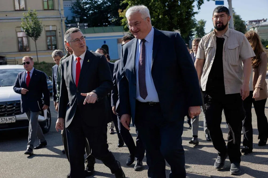 Israeli Foreign Minister Gideon Saar (left) and Ukrainian Foreign Minister Andrii Sybiha  walking in Kyiv on July 23.