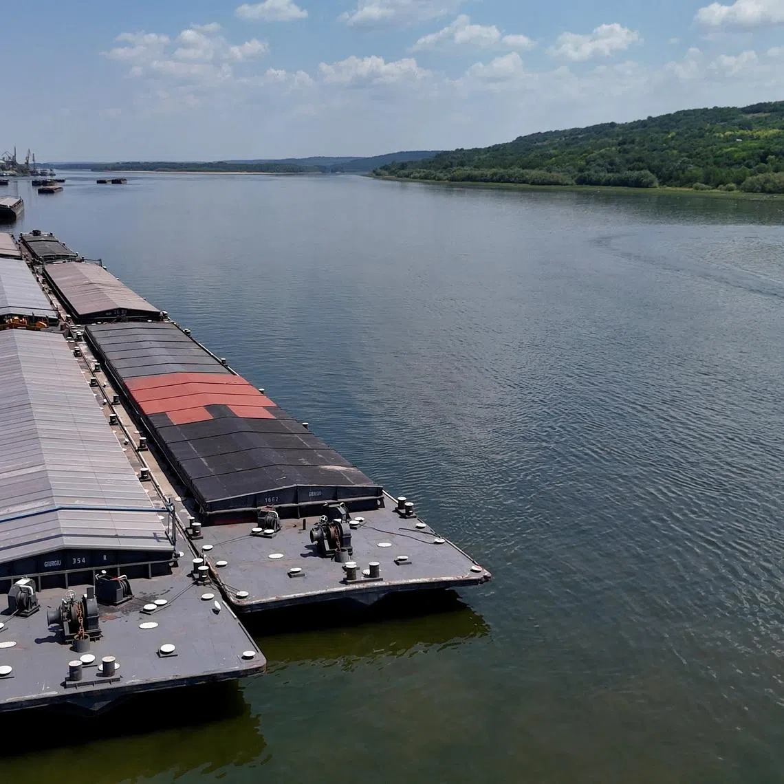 Stationary barges on the Danube, near Oltenita, Romania, July 18, 2026. Inquam Photos/Ovidiu Micsik via REUTERS ATTENTION EDITORS - THIS IMAGE WAS PROVIDED BY A THIRD PARTY. ROMANIA OUT. NO COMMERCIAL OR EDITORIAL SALES IN ROMANIA