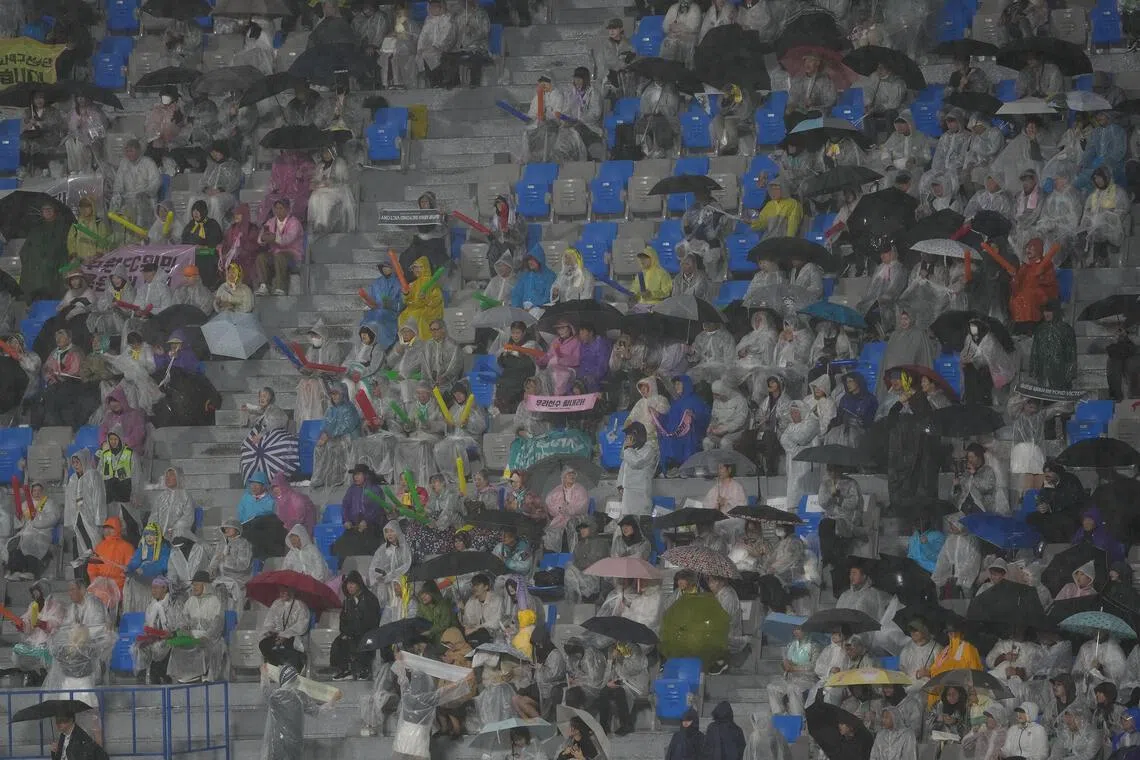 Fans cheer in the stands during a match against North Korea's Naegohyang Women’s FC vs. South Korea's Suwon FC in Suwon, South Korea on May 20.
