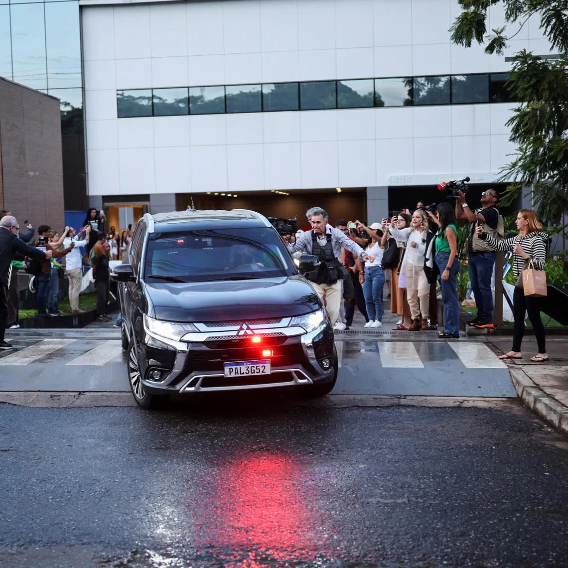 The Motorcade of Brazil's former President Jair Bolsonaro leaves the hospital after he underwent surgeries for bilateral inguinal hernia repair and to treat persistent hiccups, while serving a 27-year sentence for plotting a coup, in Brasilia, Brazil, January 1, 2026. REUTERS/Mateus Bonomi